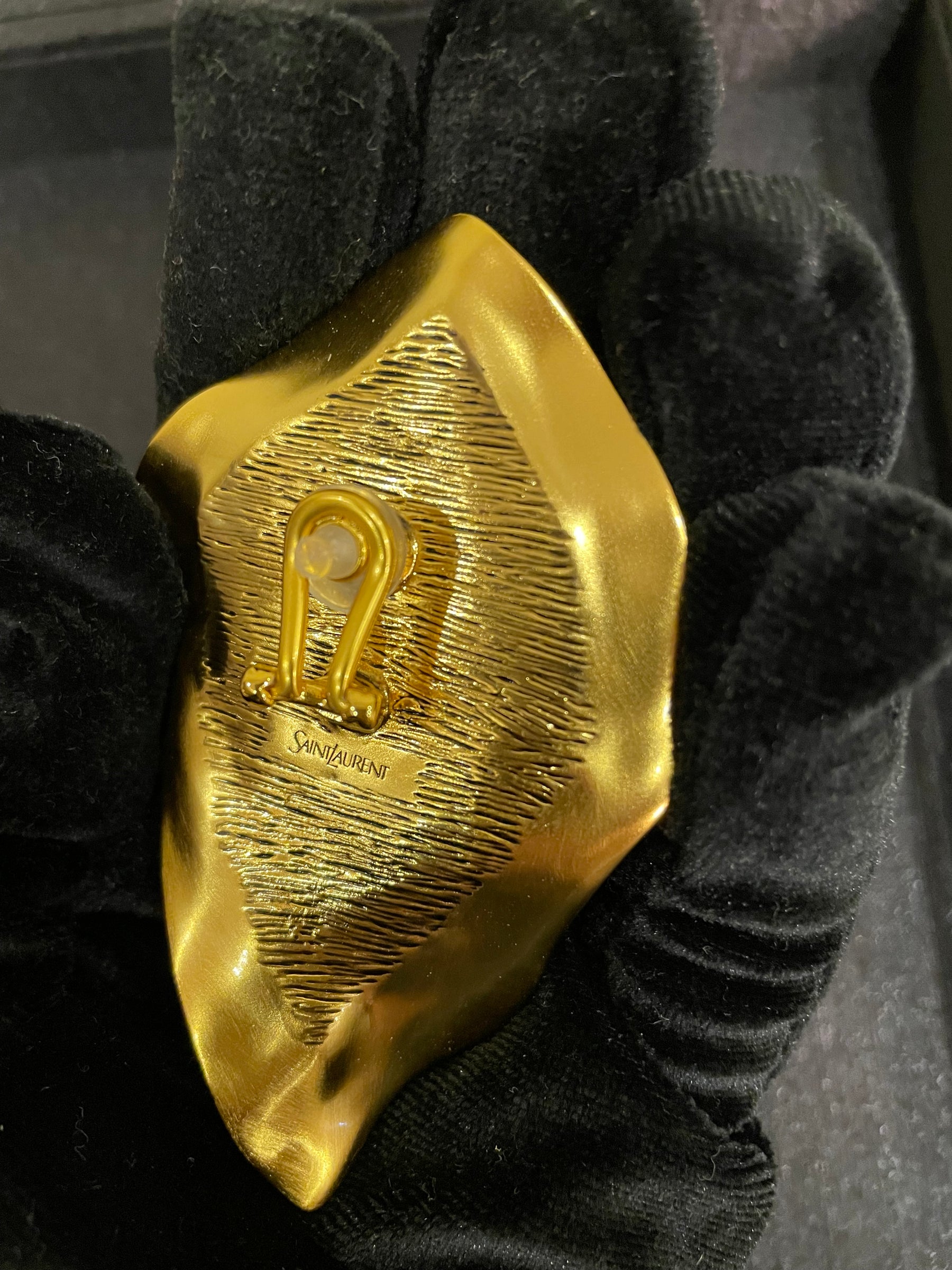 Gold-tone sculptural clip-on earring back detail showing clip-on hardware