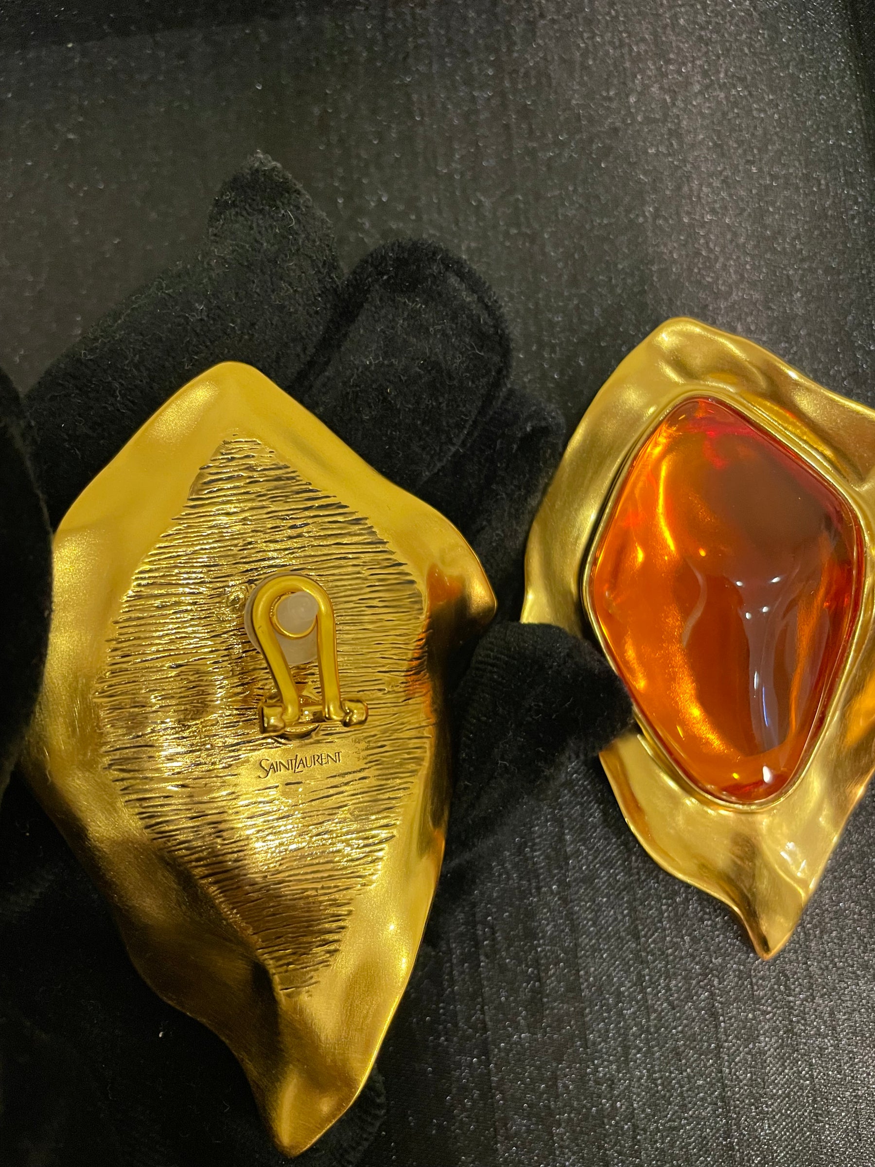 Gold-tone amber cabochon-style sculptural clip-on earrings front and back view