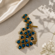 Gold-tone aqua blue heart crystal-style necklace detail view