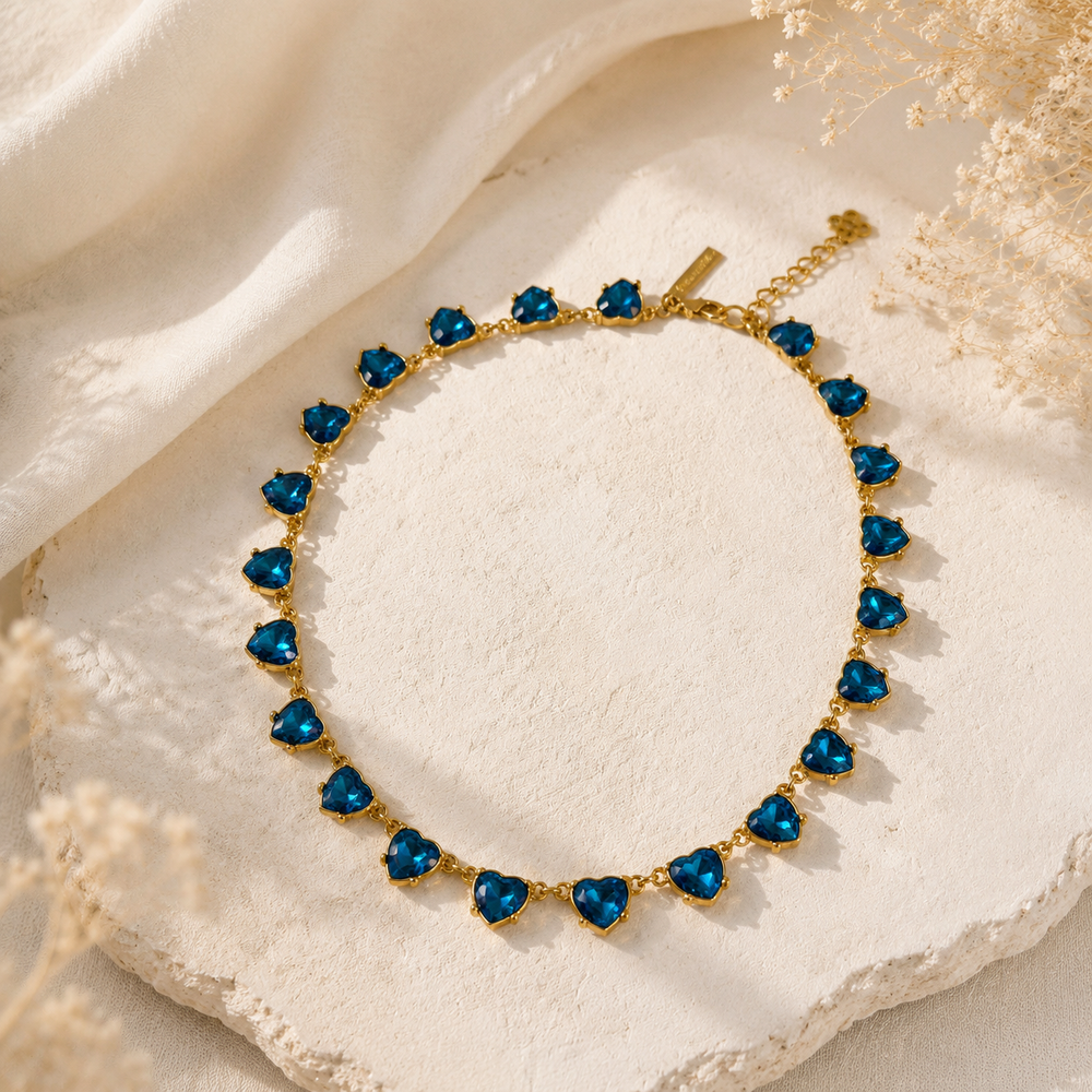 Gold-tone aqua blue heart crystal-style necklace front view