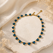 Gold-tone aqua blue heart crystal-style necklace front view