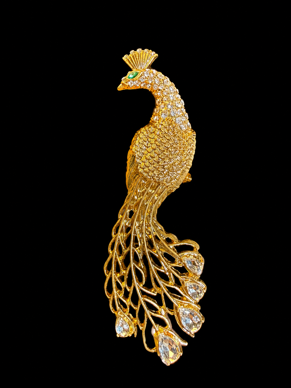 Gold-tone crystal-style peacock statement brooch front view