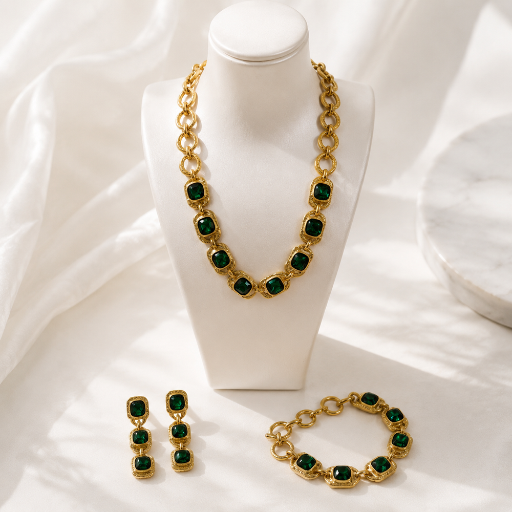 Gold-tone dark green crystal-style jewelry set with necklace bracelet and earrings display view