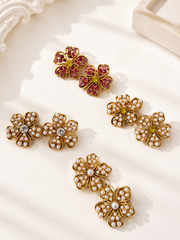 Gold-tone flower stud earrings shown in pink and pearl-style color options