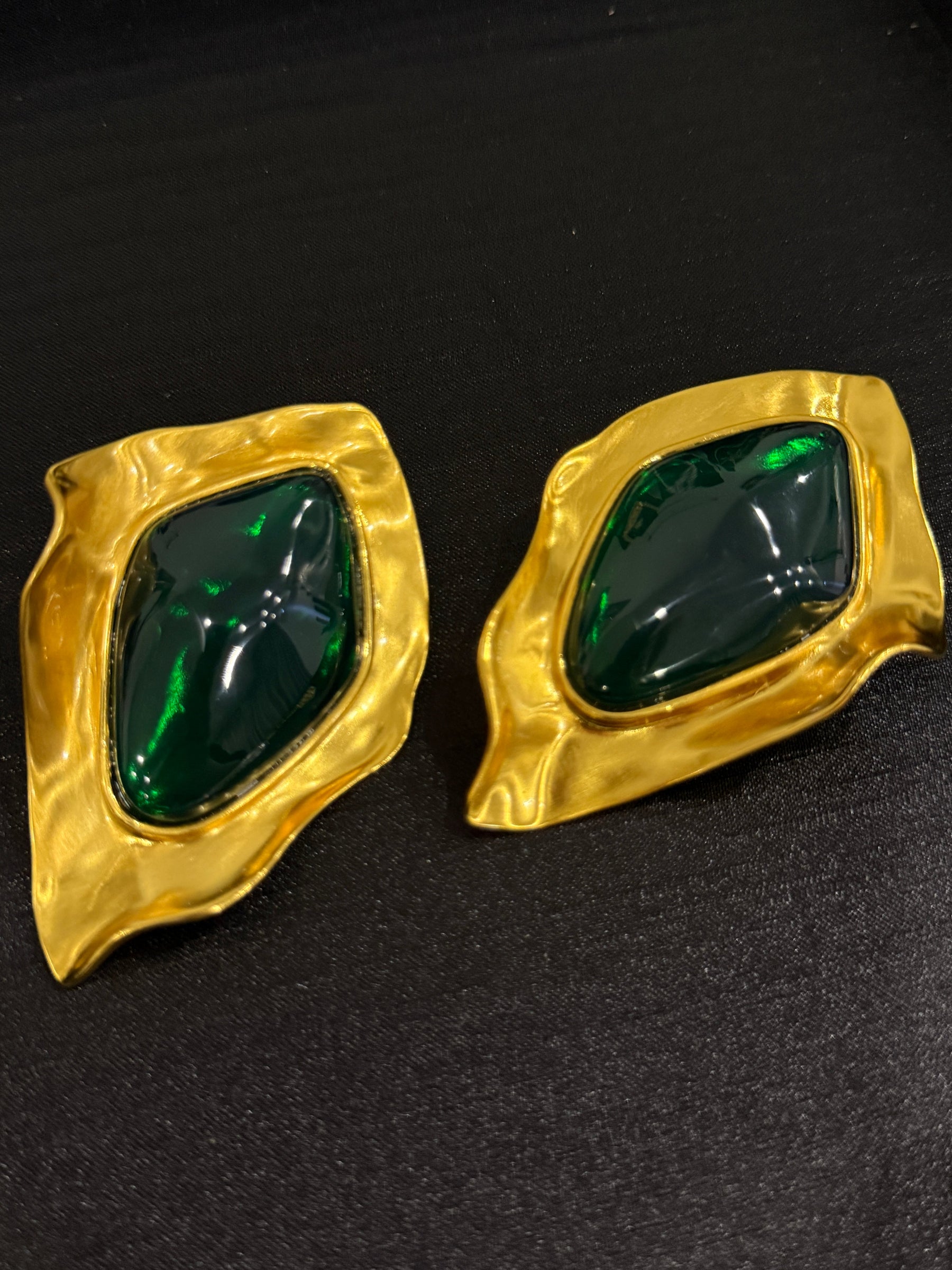 Gold-tone green cabochon-style sculptural clip-on earrings front view