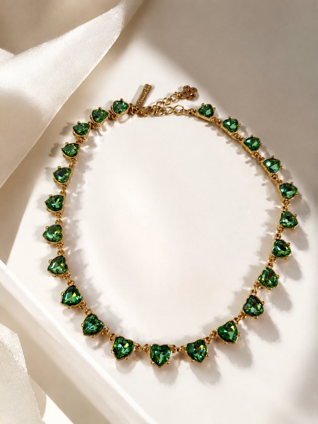 Gold-tone green crystal-style heart necklace in display box