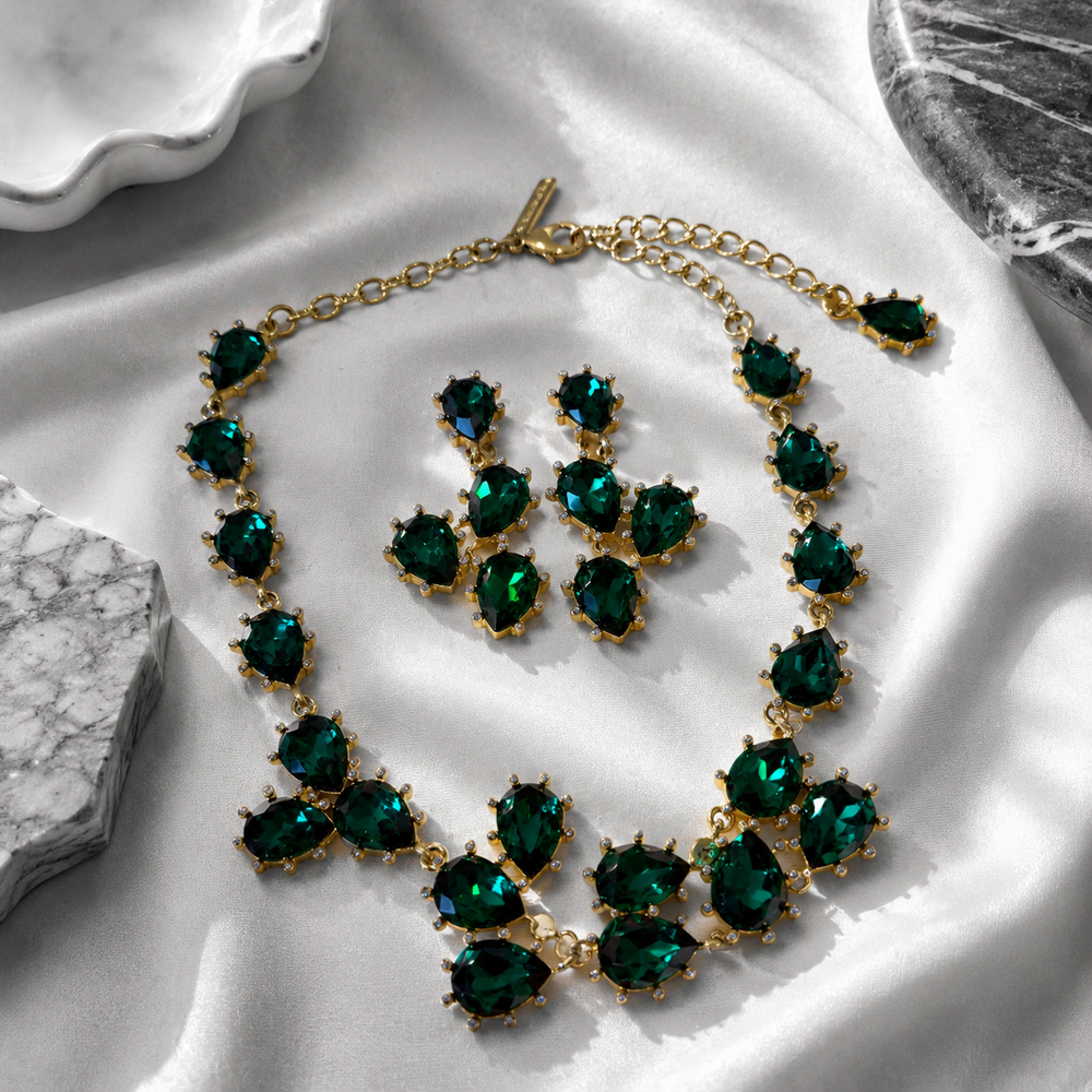 Gold-tone green rhinestone necklace and clip-on earrings jewelry set front view