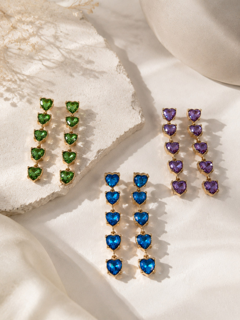 Gold-tone heart drop stud earrings in green blue and purple group view