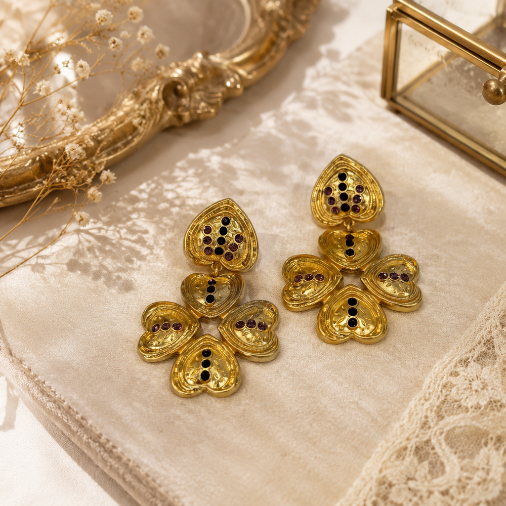 Gold-tone heart petal crystal-style drop stud earrings front view