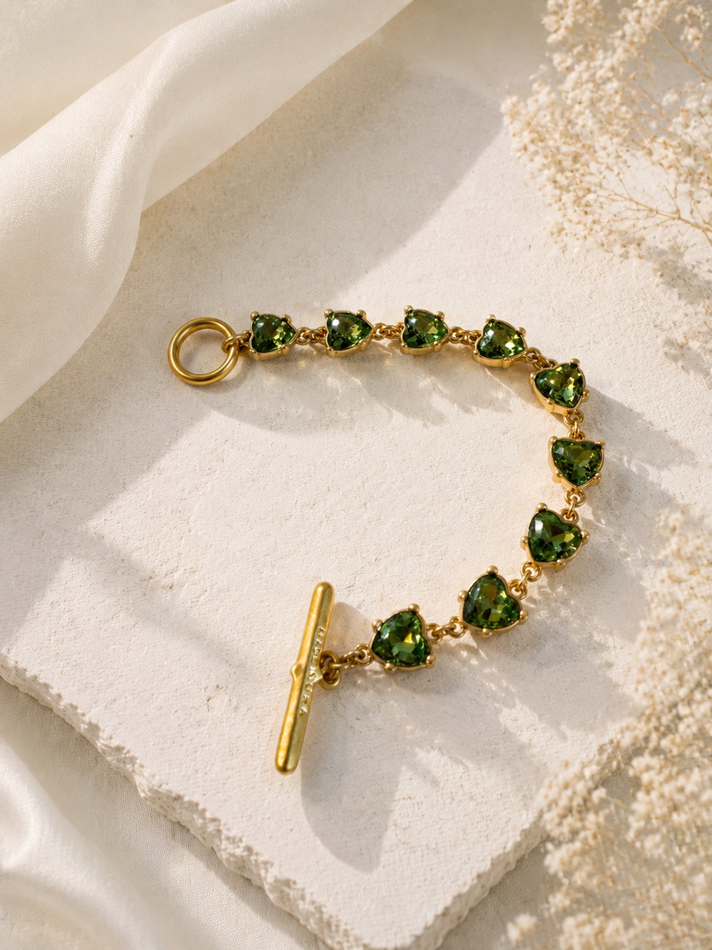 Gold-tone light green heart crystal-style bracelet front view