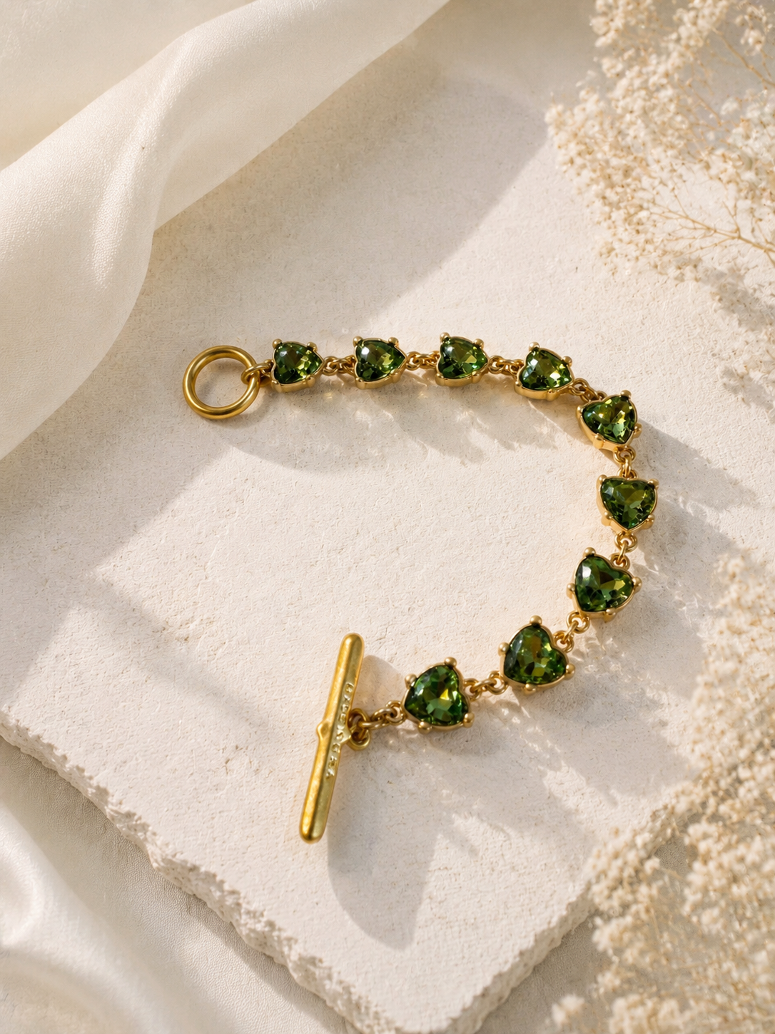 Gold-tone light green heart crystal-style bracelet front view