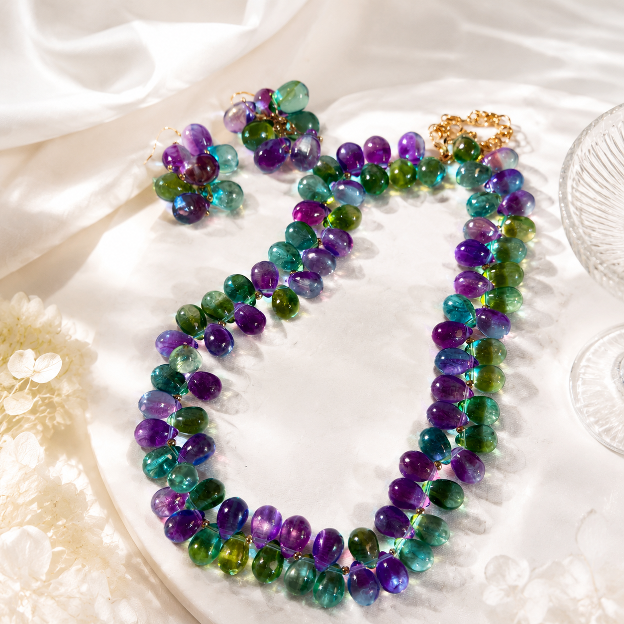 Gold-tone multicolor glass necklace and hook earrings set detail view