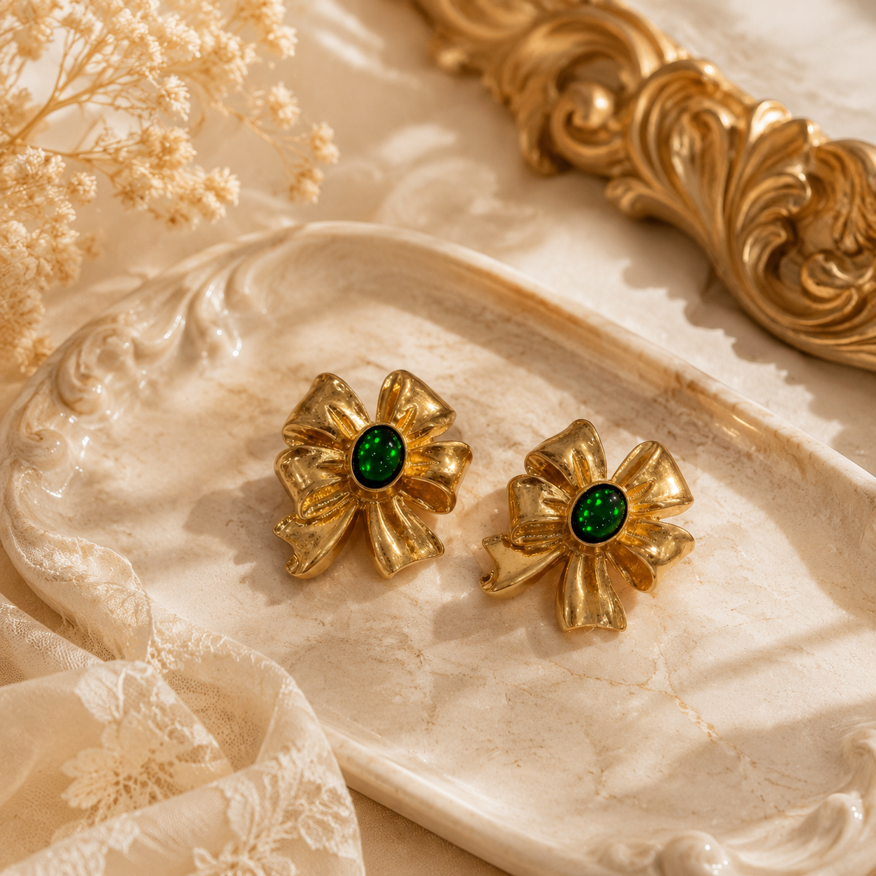 Green gold-tone oversized bow cabochon-style stud earrings flat lay