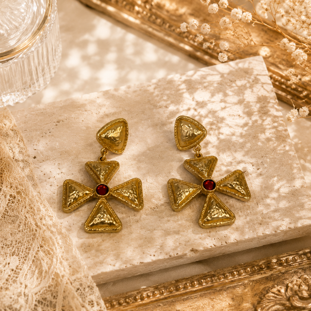 Gold-tone red crystal-style geometric cross drop stud earrings front view