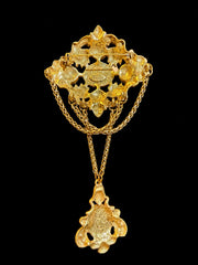 Gold-tone red glass draped chain statement brooch back view with pin closure