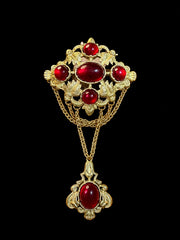 Gold-tone red glass draped chain statement brooch front view