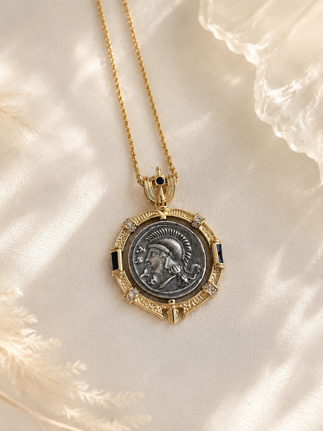 Gold-tone reversible Greek coin-style pendant necklace profile side close view