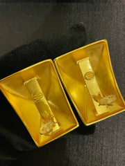 Gold-tone sculptural square clip-on earrings back angle showing clip-on hardware