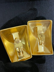 Gold-tone sculptural square clip-on earrings back view showing clip-on clasps