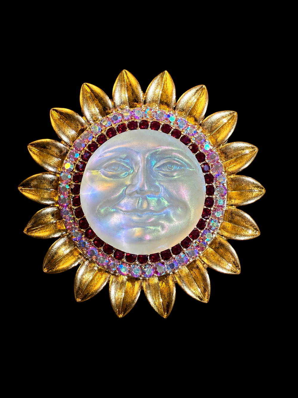 Gold-tone sun face crystal-style brooch pendant front view