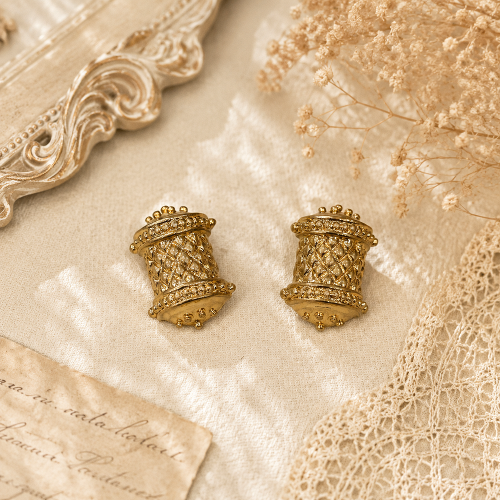Gold-tone textured lattice barrel stud earrings front view
