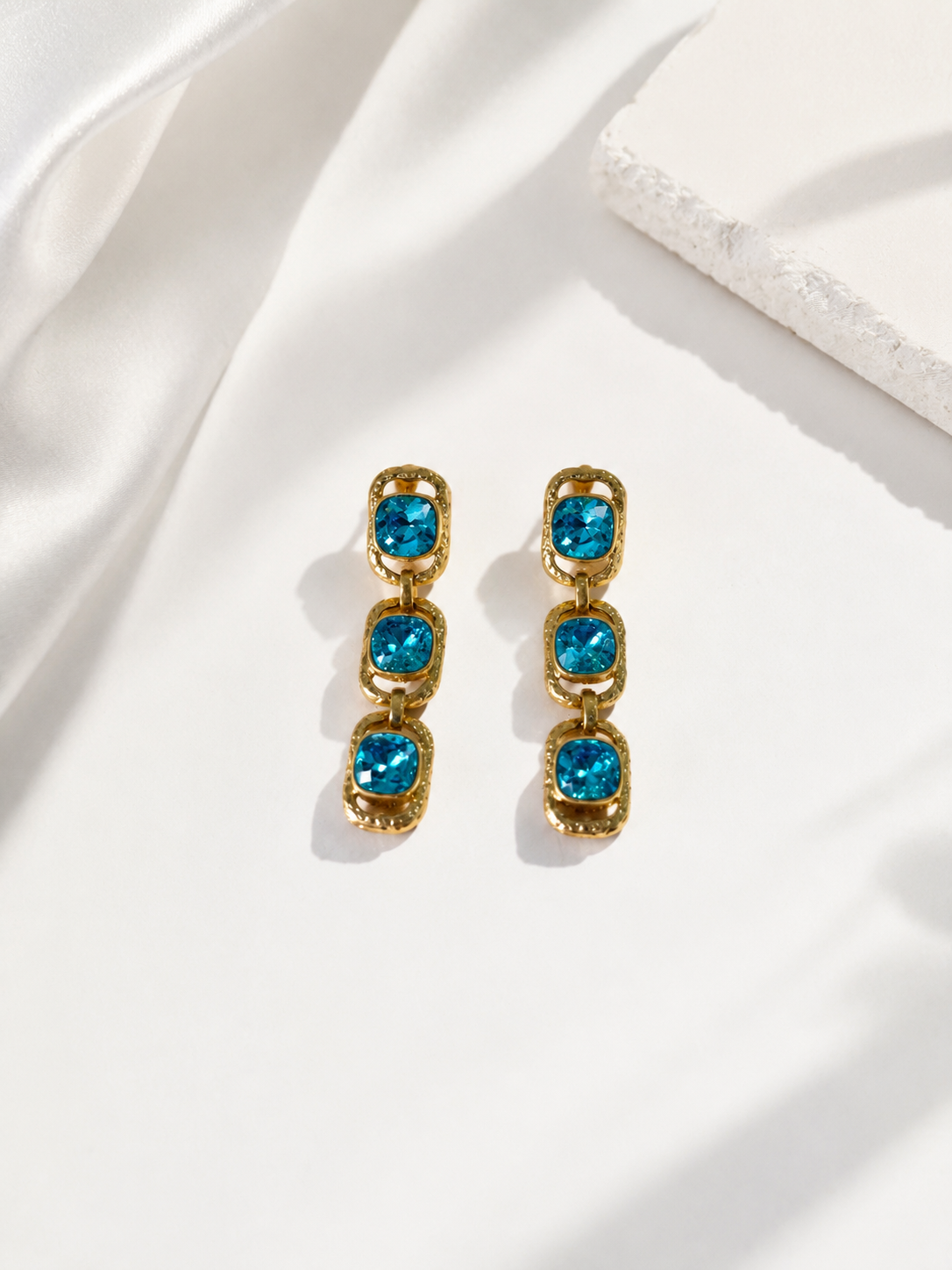 Aqua blue gold-tone triple cushion crystal-style-style drop earrings