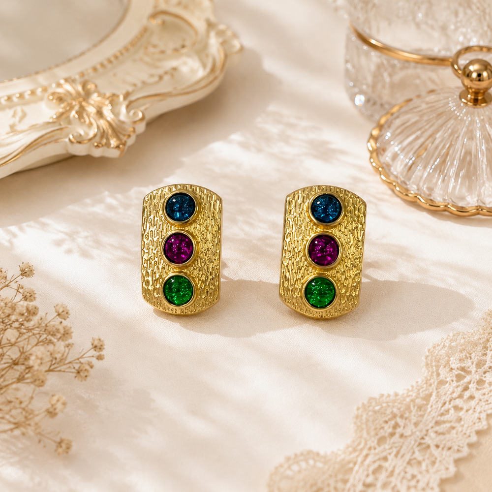 Gold-tone triple round multicolor crystal-style stud earrings front view