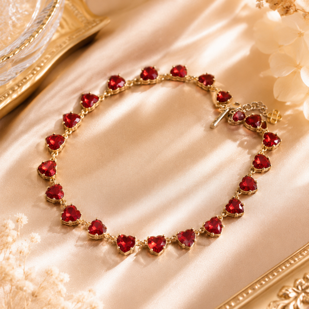 Gold-tone red crystal-style heart necklace from matching necklace set