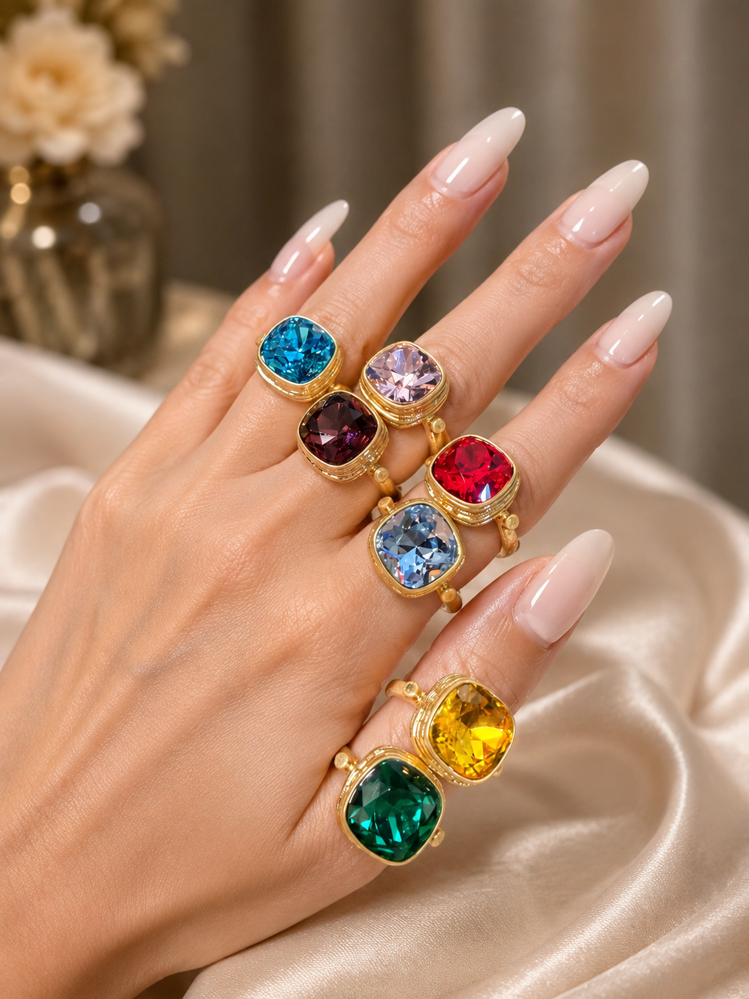 Gold-tone square statement rings shown on hand in multiple colors