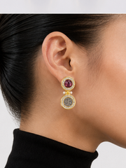 Vintage-inspired gold-tone medallion drop earrings with burgundy accents detail view