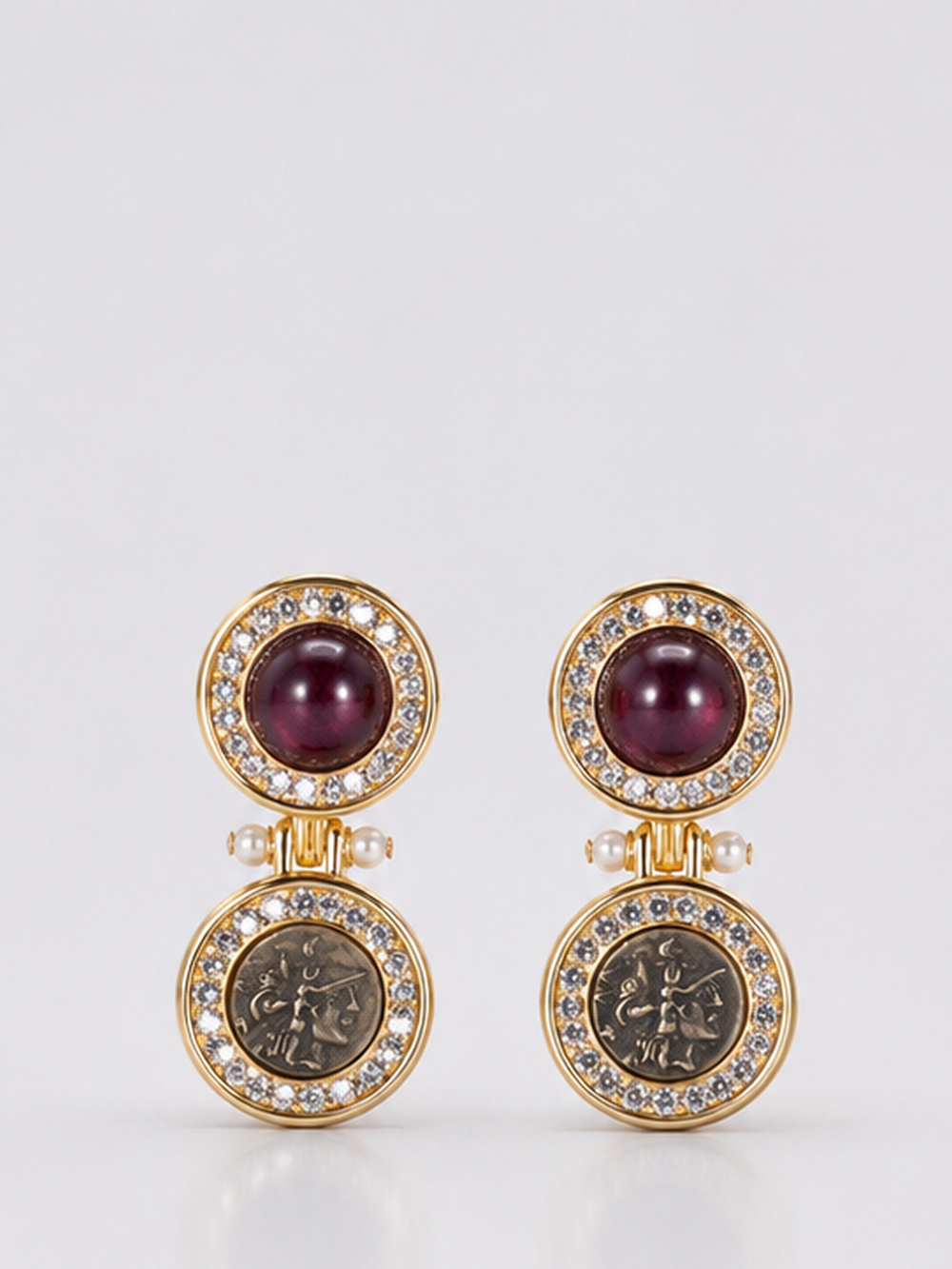 Vintage-inspired gold-tone medallion drop earrings with burgundy accents front view