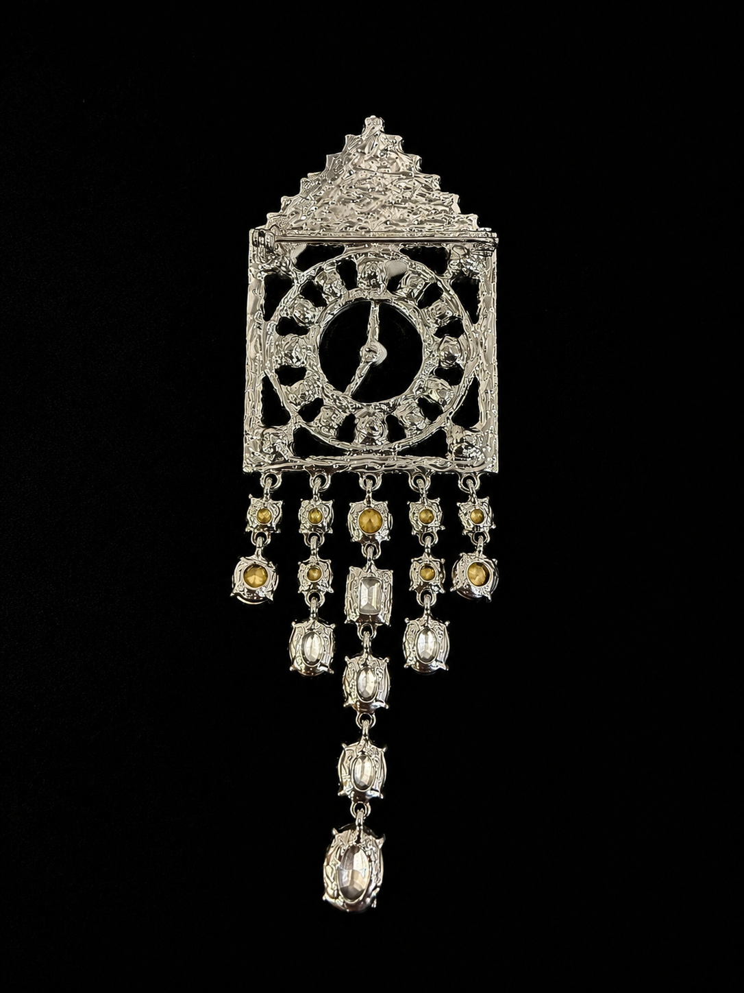 Shimmering silver-tone crystal-style clock statement brooch back view with pin closure