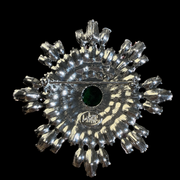 Silver-tone green cabochon-style crystal brooch pendant back view with pin closure and loop
