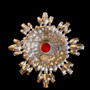 Silver-tone red cabochon-style crystal brooch pendant back view with pin closure and loop
