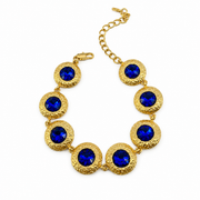 Gold-tone round-link bracelet with blue accents