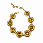 Gold-tone round-link bracelet with yellow accents