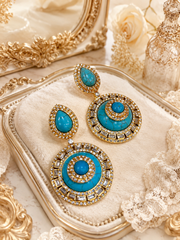 Close view of turquoise-style round accent statement earrings