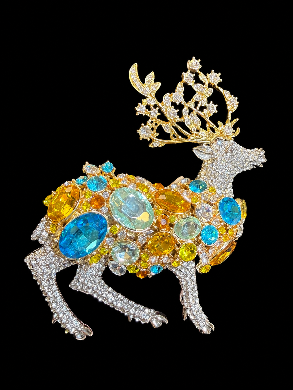 Two-tone crystal-style deer statement brooch front view with blue and yellow accents