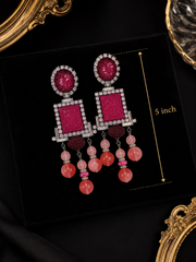 Burgundy and pink beaded drop earrings with five inch length reference