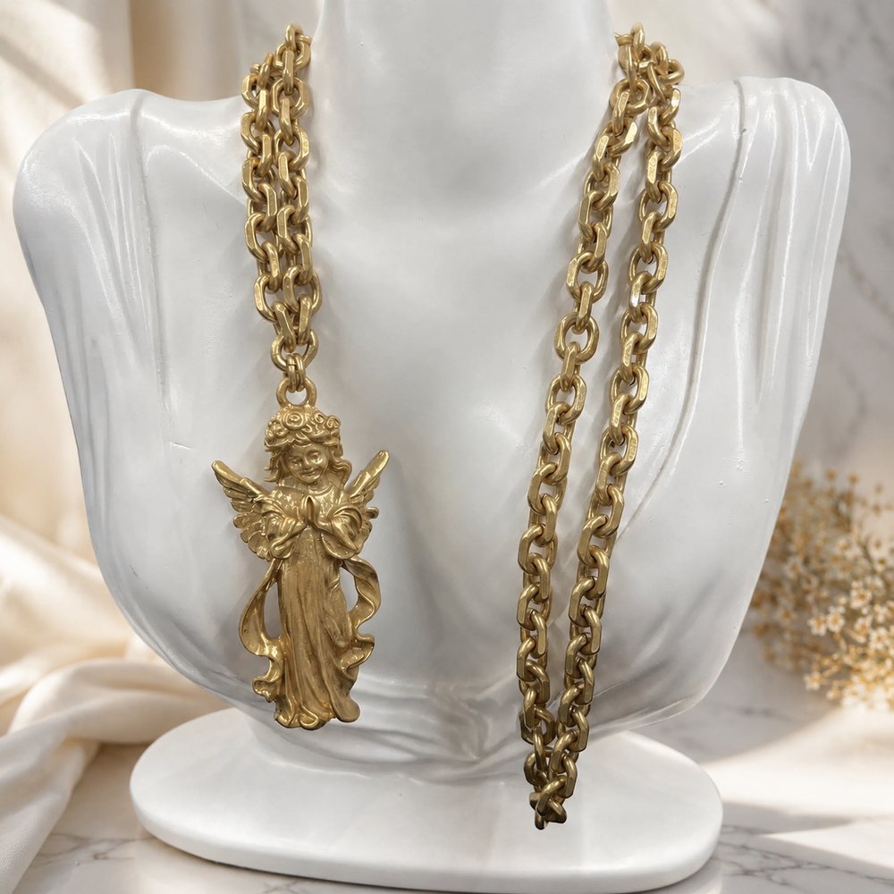 Vintage-inspired angel pendant necklace on display bust