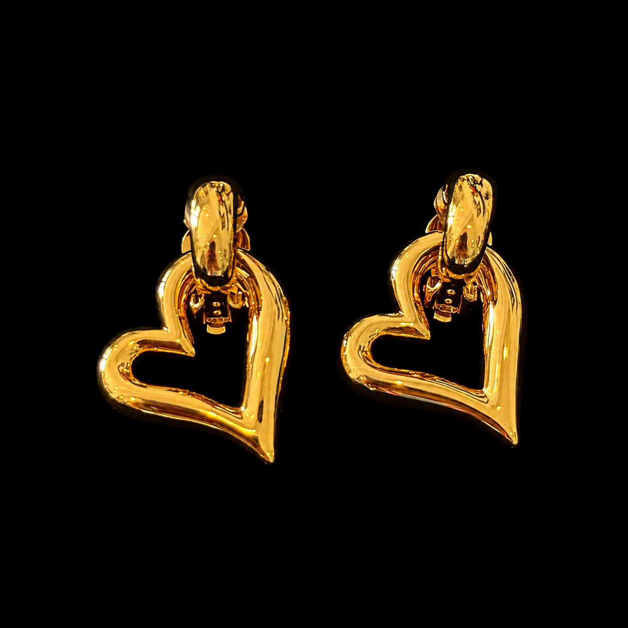 Front view of gold-tone open heart clip-on earrings