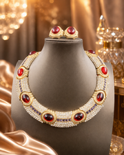 Red glass necklace and stud earrings set displayed on a jewelry stand
